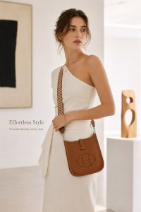 hermès mini evelyne gold brown togo leather crossbody bag – lightweight designer shoulder bag with detachable woven strap, minimalist everyday luxury