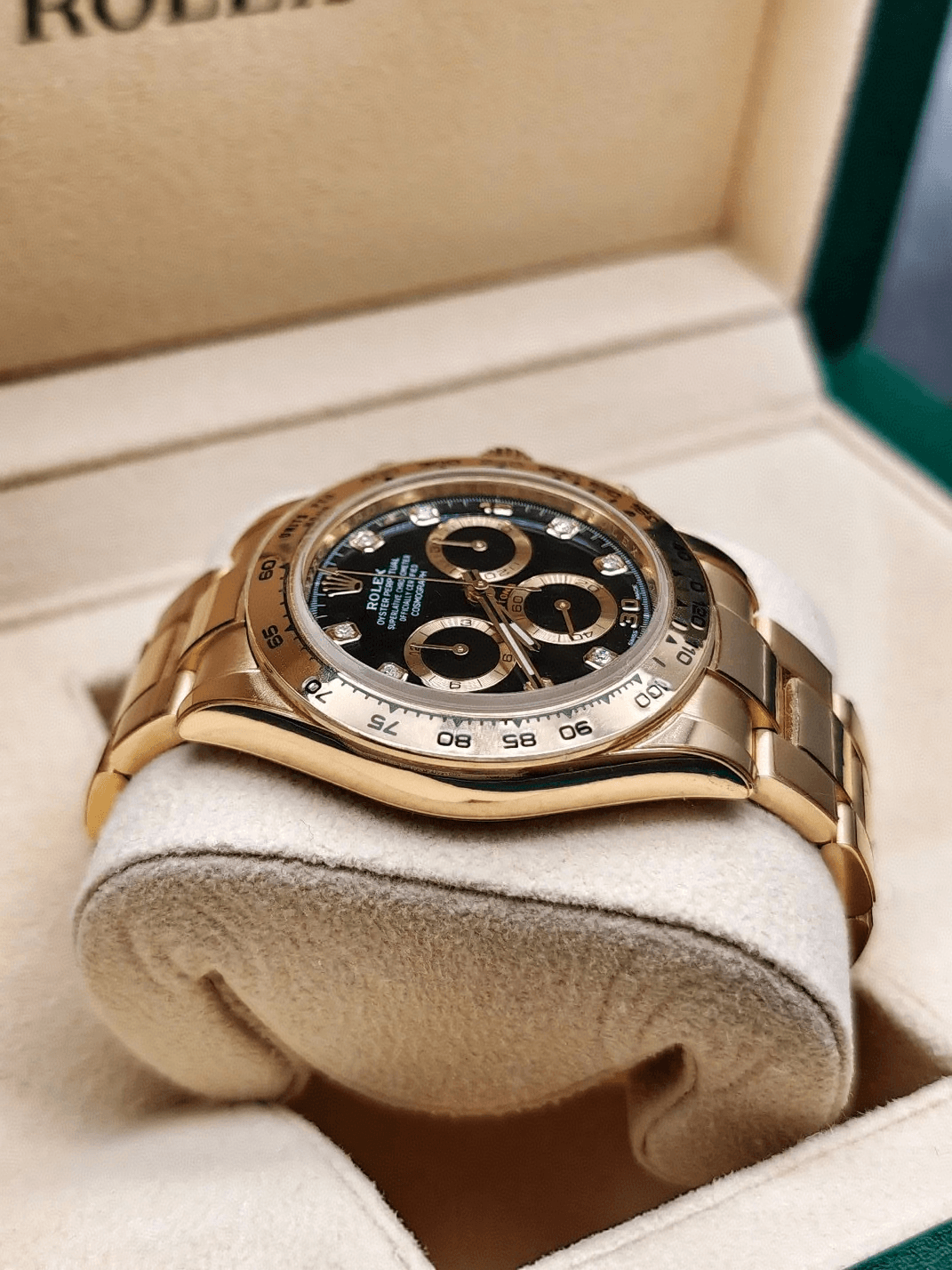 Rolex 116508 yellow gold ceramic bezel side angle charm booster photo Rolex 116508 yellow gold ceramic bezel side angle charm booster photo
