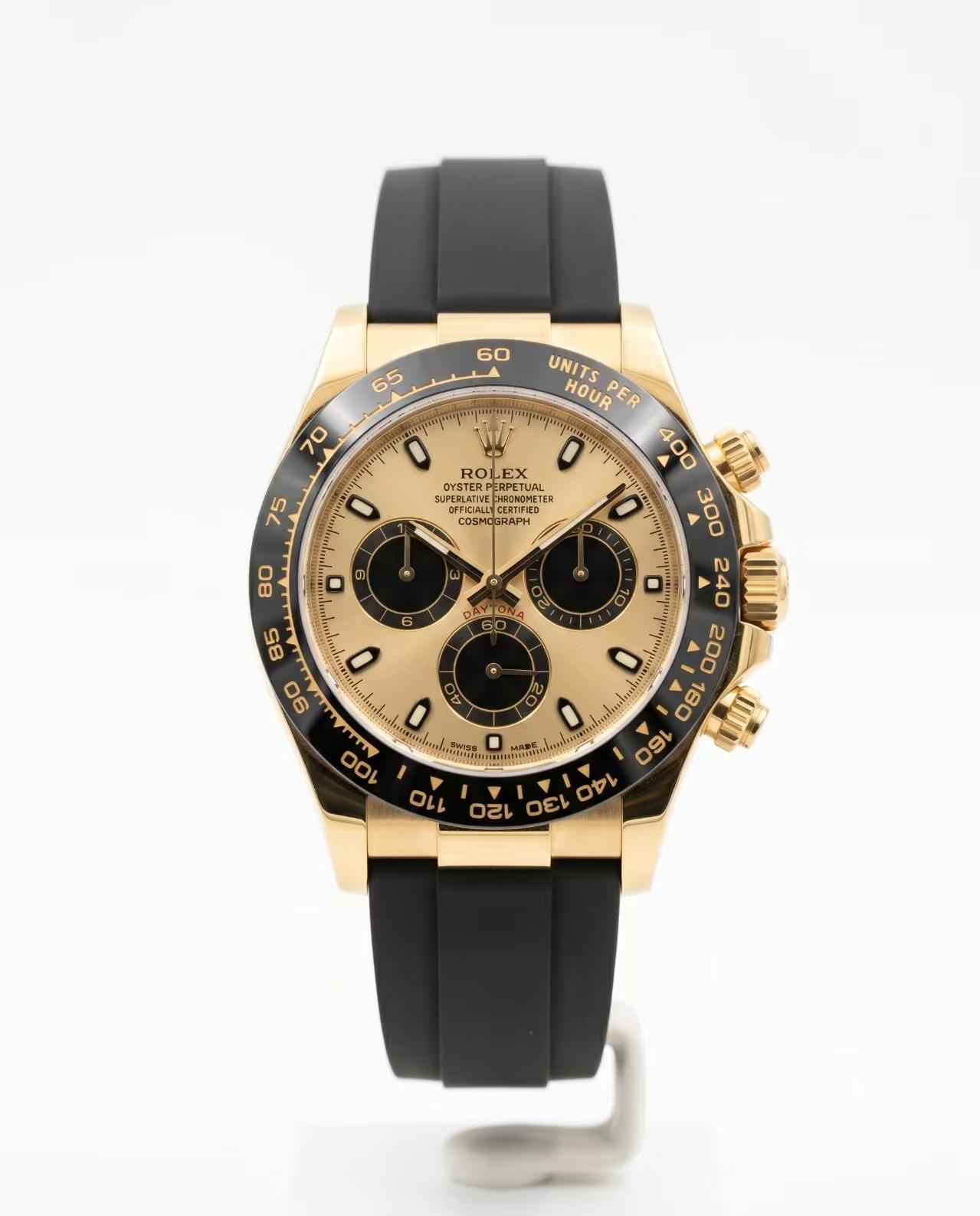 men 40mm chronograph solid yellow gold case champagne dial black ceramic bezel rubber strap watch Rolex 126518LN white dial watch front view