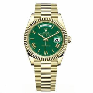 Rolex Day-Date 40 ref m228238-0061, 40mm 18K yellow gold watch, green lacquer dial with Roman numerals, fluted bezel, President bracelet, straight front official product shot, luxury men's watch